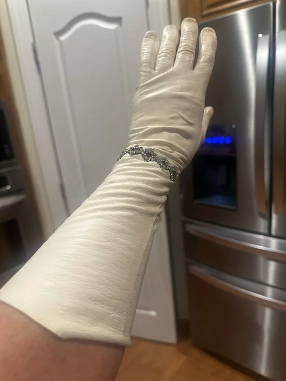 Vintage White long Gloves with‎ decorative rhinestone accents at the wrist.